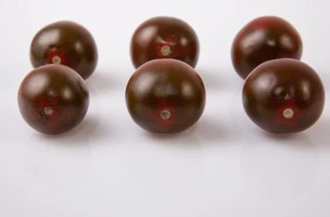 Dark green cherry tomatoes Stock Photos