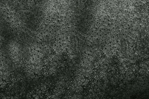 Dark green textured background creating abstract pattern with bubbles 写真素材