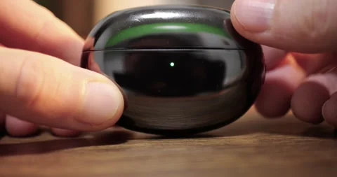 Dark Green TWS Wireless Earbuds Case Snapping Shut Magnetic Click Sound Fingers Stock Footage 321809019
