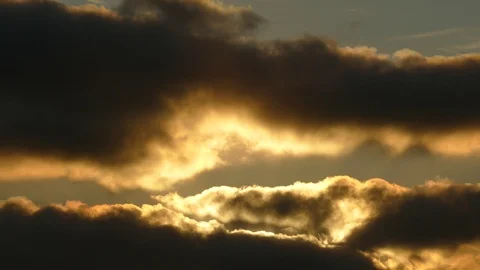 Dark grey and golden clouds at sunrise - 4k Real Time Video for Background Stock Footage 107906752