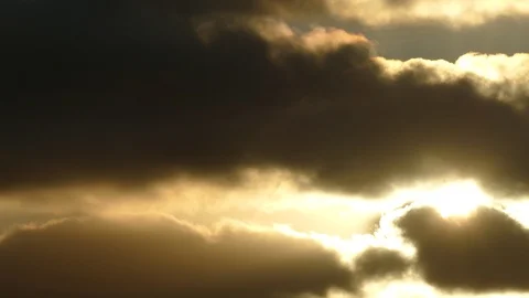 Dark grey and golden clouds with flying starling at sunrise - 4k Slow Motion Stock Footage 107972683