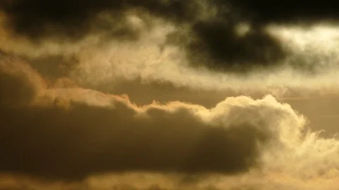Dark grey and golden clouds at sunrise - 4k Real Time Video for background Stock Footage 108000600