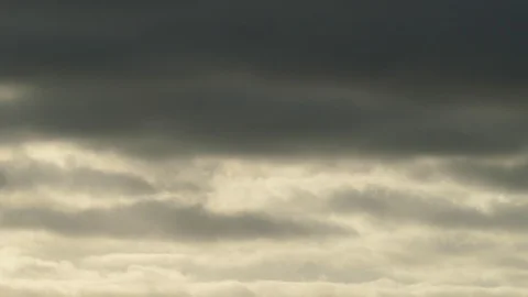 Dark grey and golden clouds at sunrise - 4k Slow Motion Video Stock Footage 108090410