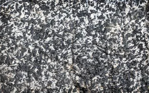 Dark grey black stone background or texture. Selective focus Stock Photos