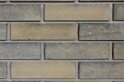 Dark grey brick wall background textured Stock Photos
