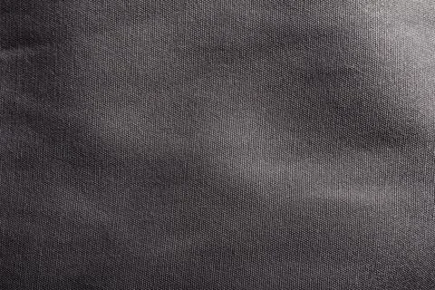 Dark grey cloth texture close-up photo. Stock Photos