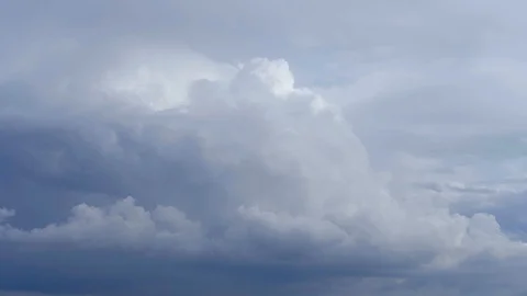  Dark grey clouds on the blue sky background. Stock Footage 118499459