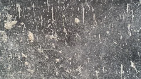 Dark grey concrete wall texture with weathered paint drips and distressed grunge Stock Photos