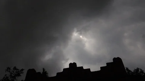 Dark grey dramatic thunderstorm rain clouds moving fast in sky by heavy winds Stock Footage 127692088