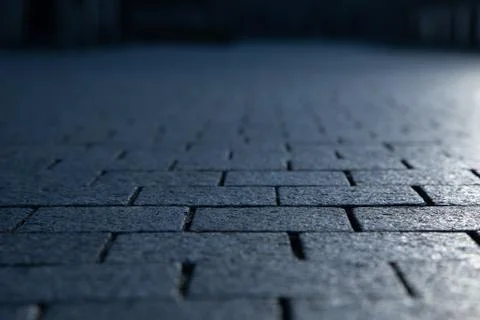 Dark grey granite rectangular pavement close-up 写真素材