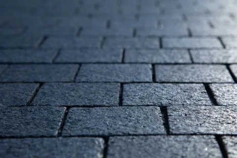 Dark grey granite rectangular pavement close-up 写真素材