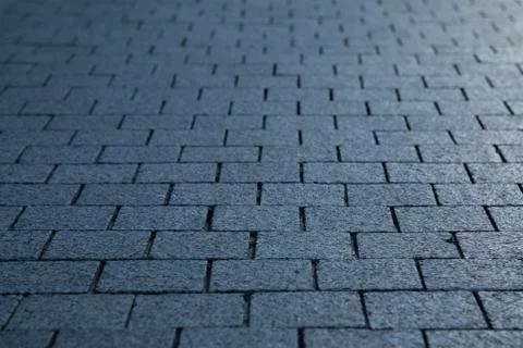 Dark grey granite rectangular pavement close-up 写真素材