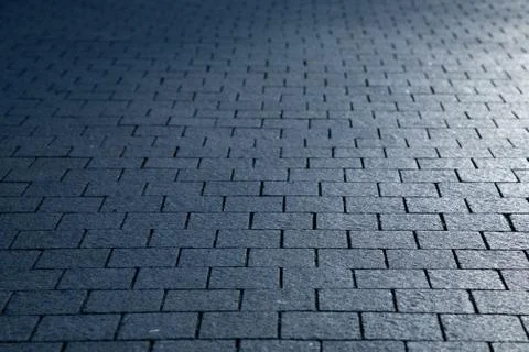 Dark grey granite rectangular pavement close-up 写真素材