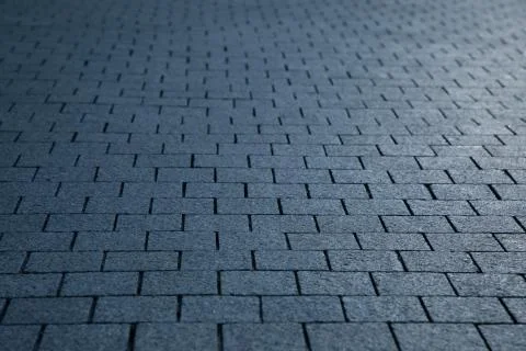 Dark grey granite rectangular pavement close-up 写真素材