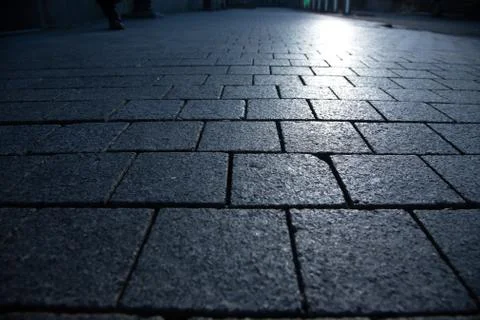 Dark grey granite rectangular pavement close-up 写真素材
