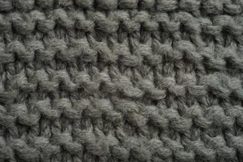 Dark grey knitted background, thread pattern Photos