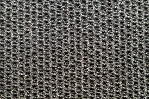 Dark grey knitted fabric texture with detailed weave pattern for background Stockfoto's
