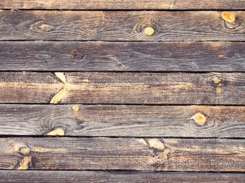 Dark grey logs with bright knots Stock Photos