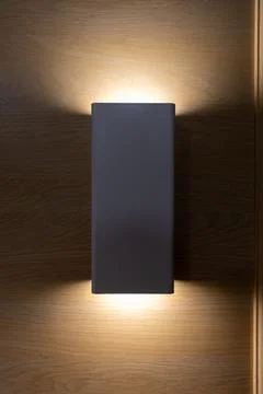 Dark Grey Rectangular Wall Lamp on Wooden Wall Foto stock