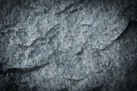 Dark grey slate background or natural stone texture, rock wallpaper Stockfoto's