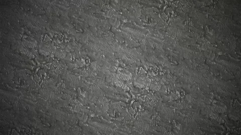 Dark grey stucco wall texture with subtle light shimmering motion Stock-Footage 341603884