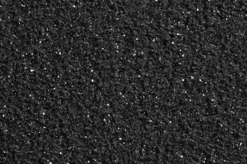 Dark grey textural background with glitter. Background for your personal use. Stock Photos