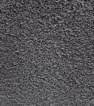 Dark grey textured plaster wall surface background Stock Photos
