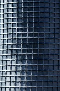 Dark grid pattern forms repeating square cells Stock Photos