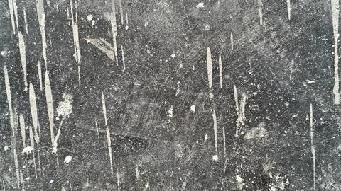 Dark grunge texture with vertical white paint drips and distressed concrete . 스톡 사진