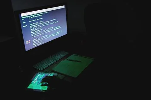 Dark, hacker and computer with coding screen for cybersecurity, malware or virus Stock Photos
