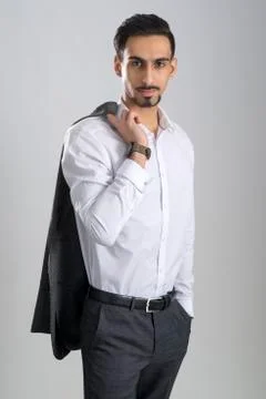 Dark-Haired Bearded Young Man in Collared White Shirt Gray Trousers Stock Photos