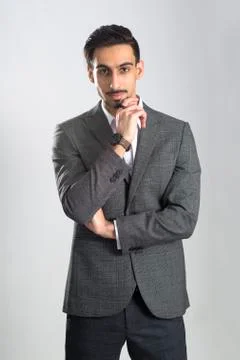 Dark-Haired Bearded Young Man in Full Gray Business Suit Stock Photos