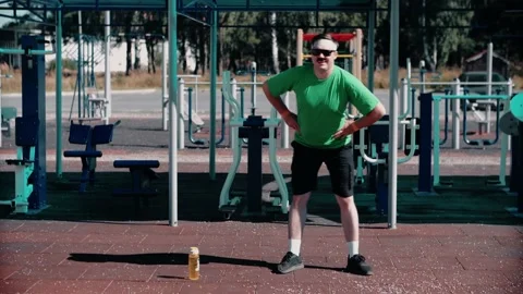 A dark-haired Caucasian athlete performs waist circles. Stock Footage 145611664
