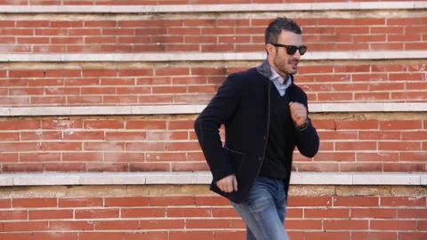 Dark-haired man moves dancing Stock Footage 132618569