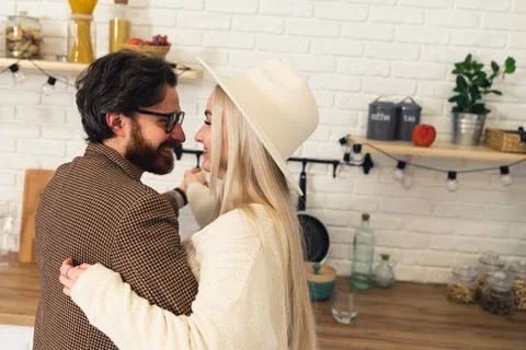 Dark-haired white man with beard and glasses and blonde white woman wearing a Stock Photos