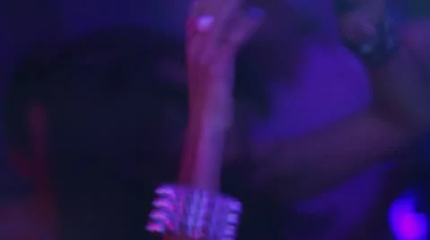 Dark haired woman with steel bracelets is dancing and enjoying herself Stock Footage
