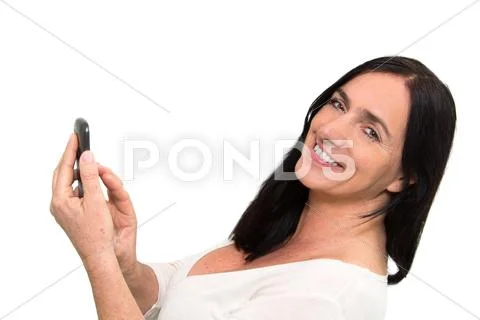 Dark haired woman using a smartphone Stock Photos