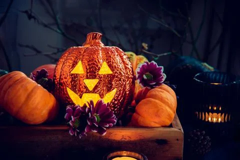 Dark Halloween composition with Lighting jack-o-lantern, decorative pumpkins Stock Photos