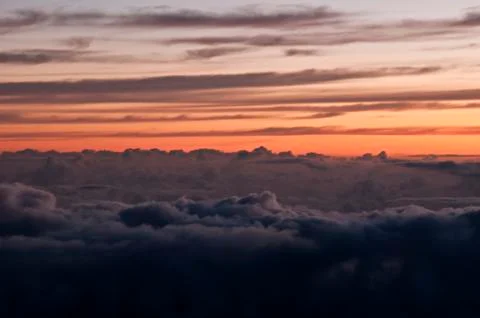 Dark heavenly clouds in the sky. the clouds are purple and the sky is a beaut Stock Photos