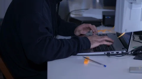 Dark hooded Hacker breaking code - portrait Stock Footage 91003382