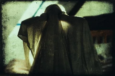 A dark horror concept. Of a haunted ghostly figure silhouetted Stock Photos