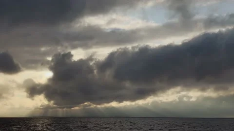 Dark huge cloud sky, black stormy cloud motion with sunrays 4k Stock Footage 145405860