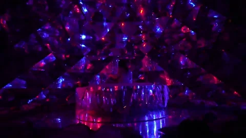 Dark immersive pavilion with glowing blue and red geometric crystals. Stock Footage 315902517