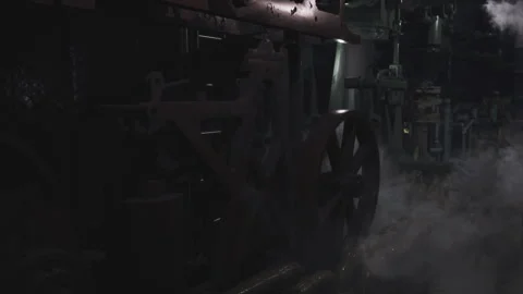 Dark industrial setting showcasing machinery with steam in workshop Vidéo 304513051