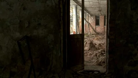 Dark Interior Looking Out Through a Doorway at Piles of Rubble and Exterior Deca Stock Footage 321290698