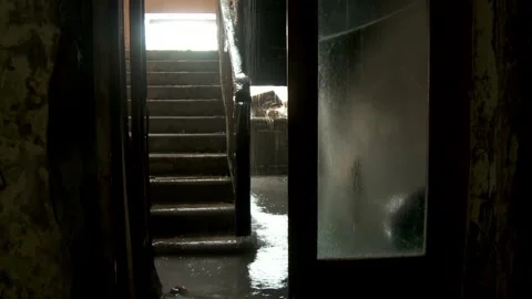 Dark Interior Shot of a Flooded Staircase with Natural Light and Reflections in  Video stock 321290100