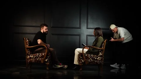 Dark interview style indoor studio setup with people face to face and Video stock 270447856