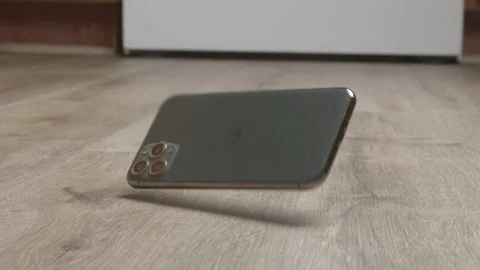 Dark iphone dropped on floor Video stock 168322532