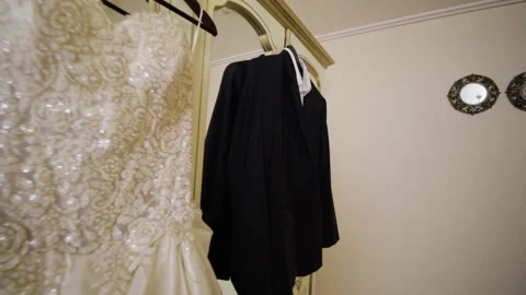 Dark jacket with trousers and white shirt and white wedding dress Stock Footage 171639062