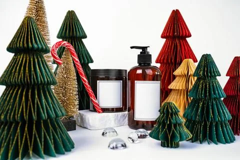 Dark jar with lid and dispenser on the background of Christmas decorations, side Stock Photos